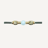 Pulsera con piezas doradas y perla para mujer